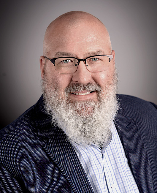 Professional headshot of Philip Hastings at Precious Plate.