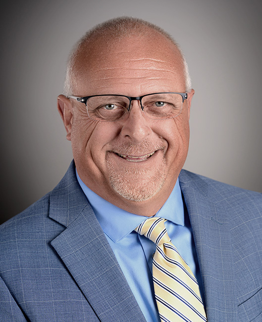 Professional headshot of John McKinney at Precious Plate.