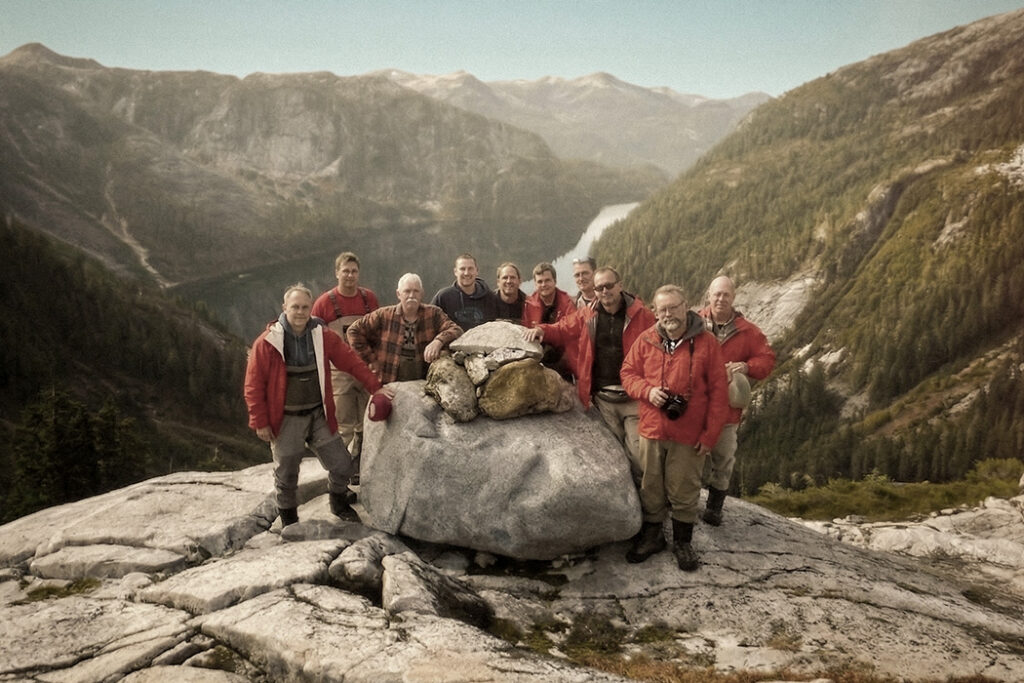A group portrait of the original engineers and founders who started Precious Plate's legacy in 1973.